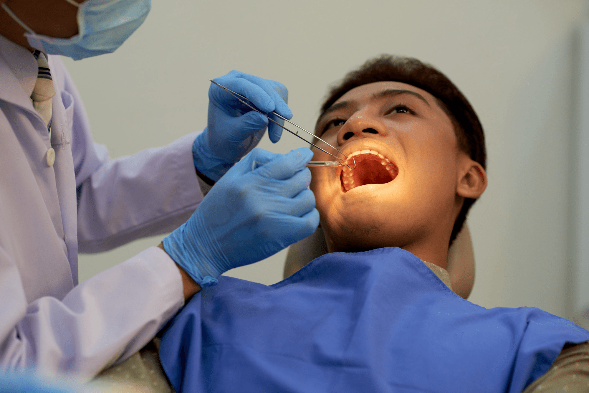 Man undergoing root canal treatment.