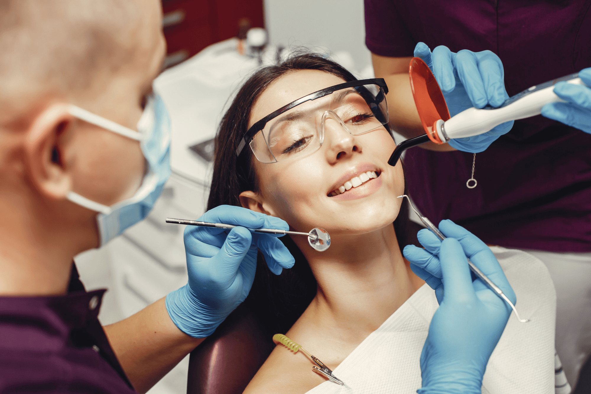 Woman at dentist with cosmetic dentistry tools.