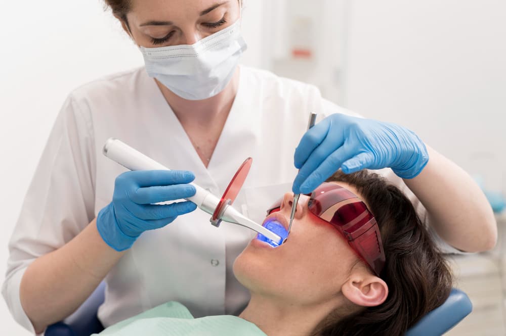 Female patient having a procedure done at the dentist.